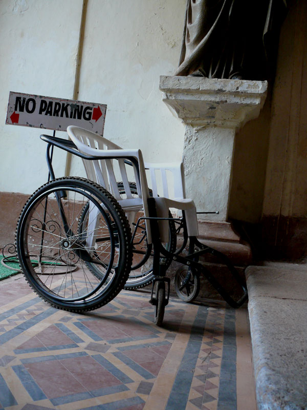 A wheel chair and a no parking sign inside the Bom Jesus Church, copyright Picturejockey : Navin Harish 2005-2009