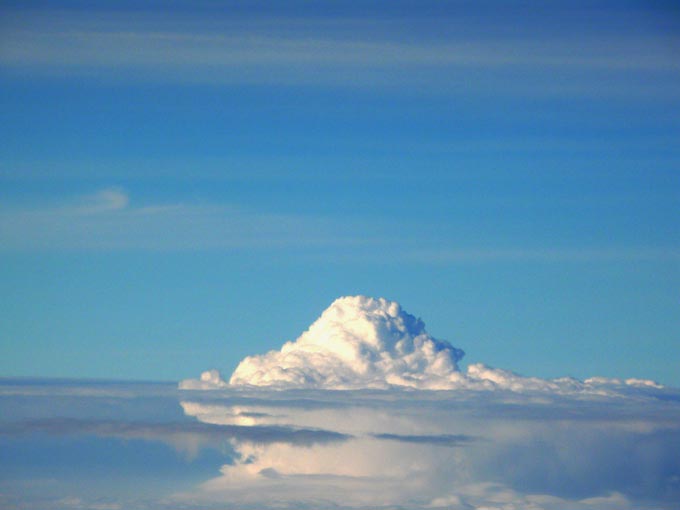 Cloud or an iceberg - An image of a cloud taken from on a flight from Bombay to Hyderabad  | copyright Picturejockey : Navin Harish 2005-2007