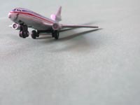 Papa is going to buy a big plane for me - An mage of a cast iron model of an Americal Airlines jet