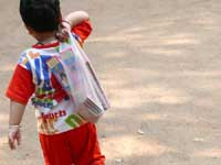 Manu ke patakhe - An image of Manu carrying his crackers on Diwali