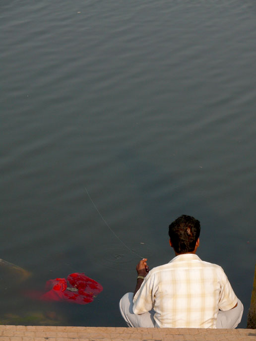 Gone fishing - An image of a man fishing in Powai lake | copyright Picturejockey : Navin Harish 2005-2007