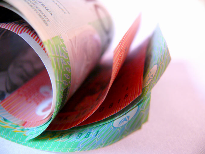 Redefining plastic money - an image of rolled up Australian Dollars | copyright Picturejockey : Navin Harish 2005-2007