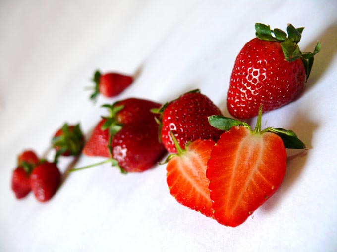 Strawberries - an image of cut and whole strawberries | copyright Picturejockey : Navin Harish 2005-2007
