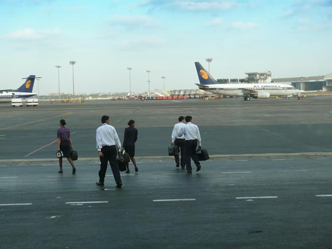 Which way to our plane? - An image of the staff of Jet Airways staff including the air hostesses, pilot and the other crew walking towards the plane at Chhatrapati Shivaji Airport, Mumbai  | copyright Picturejockey : Navin Harish 2005-2007