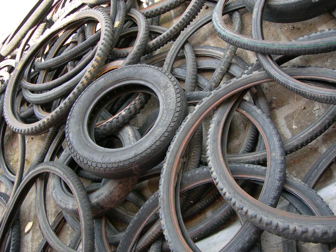 Have gone through miles and now I sleep - An image of old cycle and scooter tyres  | copyright Picturejockey : Navin Harish 2005-2007