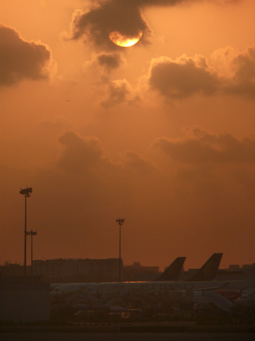 Red sky - An image pf a sunset at Chhatrapati Shivaji Airport, Mumbai  | copyright Picturejockey : Navin Harish 2005-2007