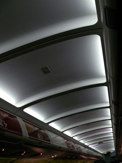 Advertising 24X7 - An image of inside of an Air Deccan plane showing the ads of NDTV| copyright Picturejockey : Navin Harish 2005-2007