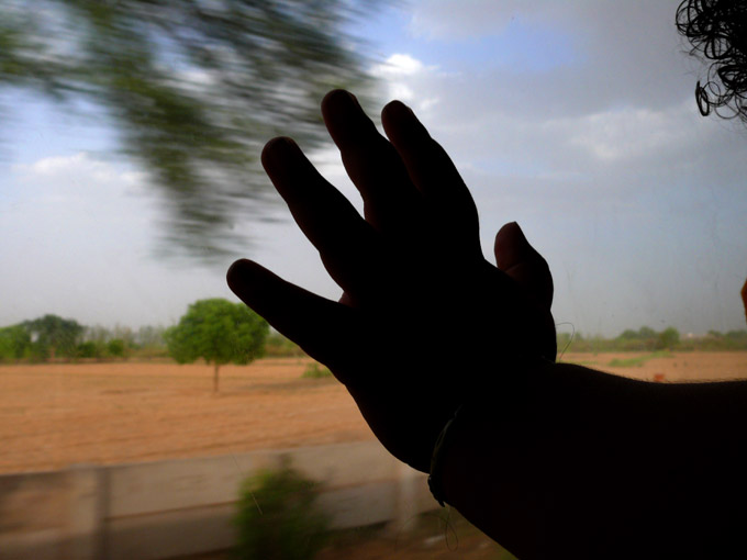 Rajdhani Express - An image of Manu looking out of the Rajdhani Express on our journey from Delhi to Bombay | copyright Picturejockey : Navin Harish 2005-2007 Rajdhani Express - An image of Manu looking out of the Rajdhani Express on our journey from Delhi to Bombay | copyright Picturejockey : Navin Harish 2005-2007