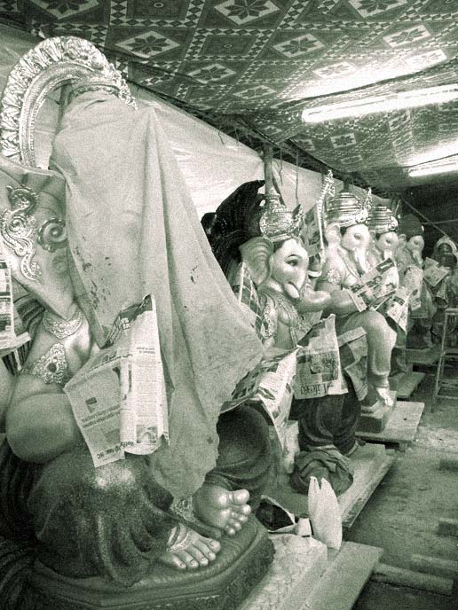 Ganpati on bench? - An image of idols of ganpati in a workshop in Jogeshwari, Mumbai | copyright Picturejockey : Navin Harish 2005-2007