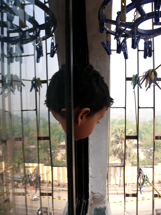 It's me...again - An image of Manu looking out of our bedroom window and his reflection | copyright Picturejockey : Navin Harish 2005-2008