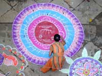 Rangoli competition - An image of a woman making rangoli for a competition during navratri