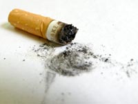 No more smoking in public places - An image of a Gold Flake cigarette butt