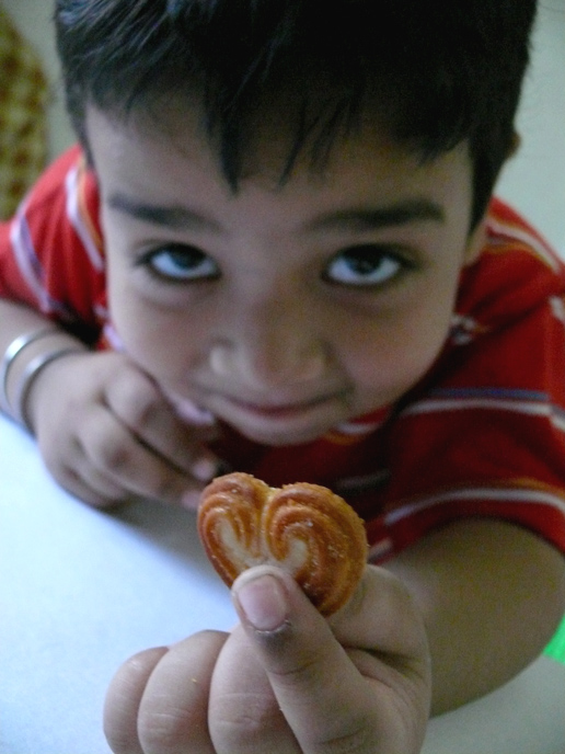 Manu holding a Britannia Little Heart biscuit, copyright Picturejockey : Navin Harish 2005-2008