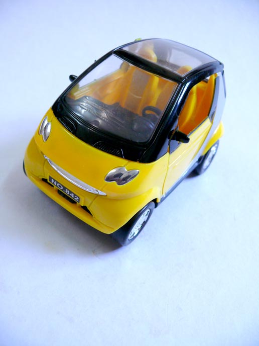 A Chinese yellow toy car, copyright Picturejockey : Navin Harish 2005-2008