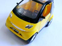 Is this a Tata Nano or the Smart car? : A Chinese yellow toy car 