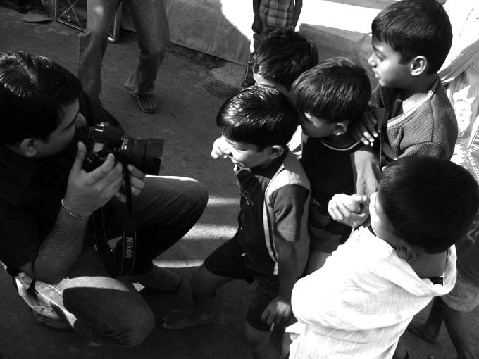 The future is bright - An image of Ashish Sidhapara taking picture of kids at Walkeshwar | copyright Picturejockey : Navin Harish 2005-2008