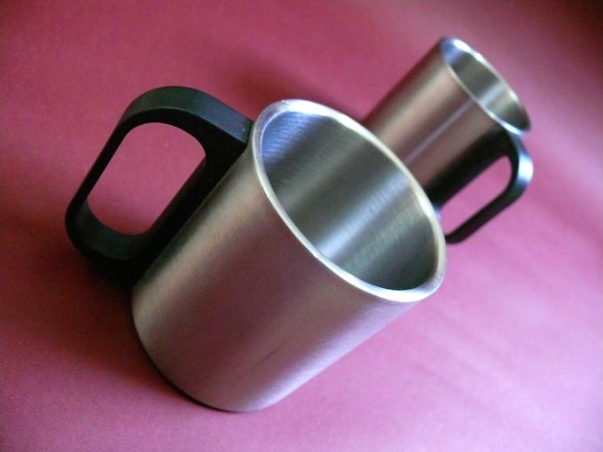 Ek galassi, do galassi, teen galassi, chaar...  - An image of two steel coffee mugs | copyright Picturejockey : Navin Harish 2005-2008
