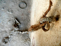 Tie a rope, to be extra safe - An image of a hook with a chain and rope