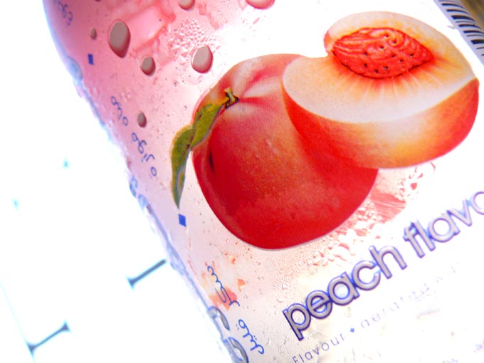 My Carbon foorptint is bigger than yours - An image of a peach drink in a plastic can  | copyright Picturejockey : Navin Harish 2005-2008