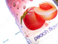 My Carbon foorptint is bigger than yours - An image of a peach drink in a plastic can