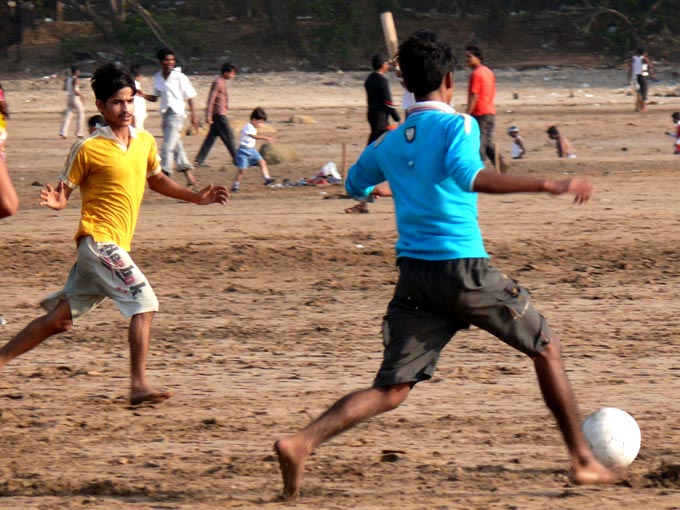 Beach soccer - An image of boys blaying football at Aksa beach, Madh, Mumbai | copyright Picturejockey : Navin Harish 2005-2008