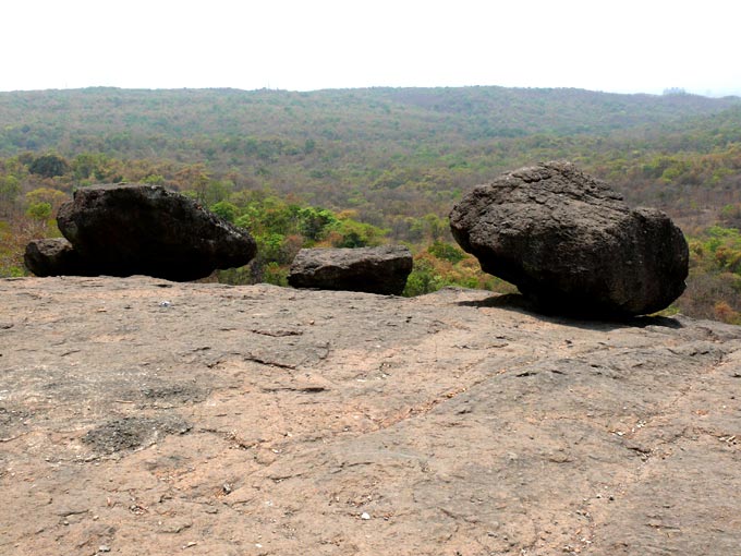 On gentle push - An image of three rocks placed at the edge at Kanheri Caves, Borivali, Mumbai | copyright Picturejockey : Navin Harish 2005-2008