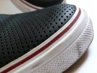 The shoe with holes - An image of Converse All Stars canvas shoes
