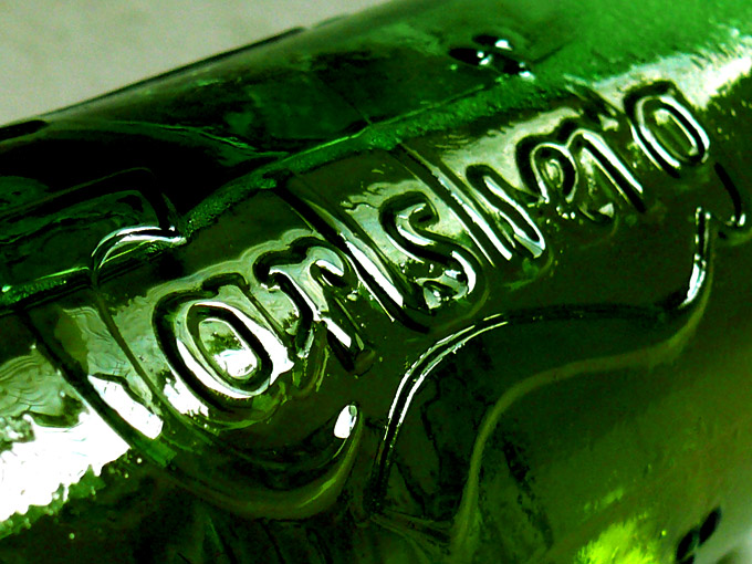 Probably the best beer in the world - An image of the bottle of Carlsberg beer showing the embossed logo : Navin Harish 2005-2008