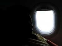Window seat - An image of Mira in the plane on our way to Delhi from Bombay