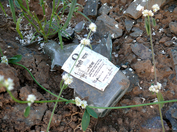 A broken bottle of orange flavoured country liquor , copyright Picturejockey : Navin Harish 2005-2009