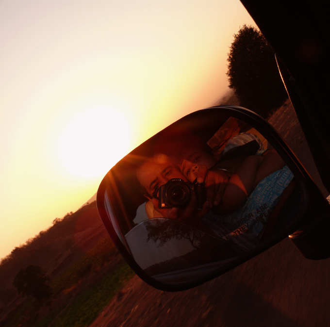 Manu and me in the rear view mirror against the sunset, copyright Picturejockey : Navin Harish 2005-2009