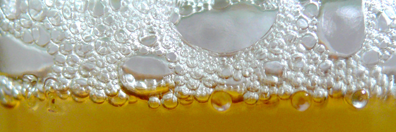 close of bubbles in a Beer bottle, copyright Picturejockey : Navin Harish 2005-2009