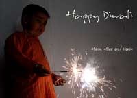 Wishing you all a Happy Diwali - Manu with a fuljhari or a tadtadi as it is know in Bombay