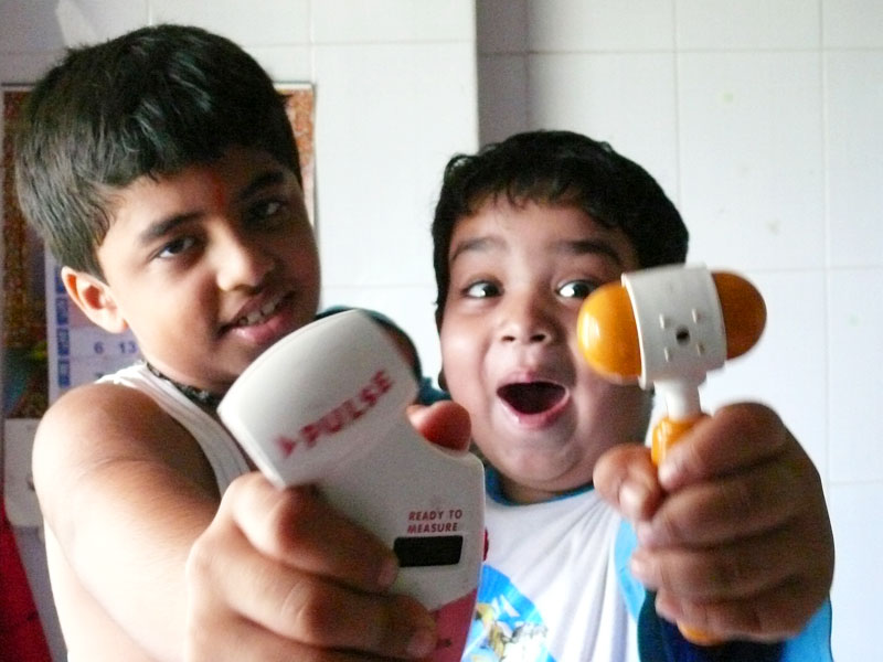 Manu with his friend Nayan playing doctor, copyright Picturejockey : Navin Harish 2005-2009