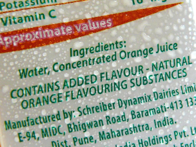 A tetrapack of tropicana 100% orange juice showing its ingredients by Pepsico , copyright Picturejockey : Navin Harish 2005-2009