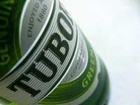 To open a beer bottle - A bottle of Tuborg Beer by Picturejockey