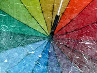 Rain rain go away... - Reflection of a multi colour umbrella