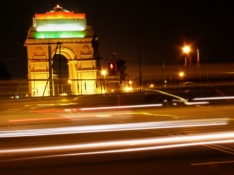 India Gate lit at night with streaks of car headlights Driving past India Gate, copyright Picturejockey : Navin Harish 2005-2009